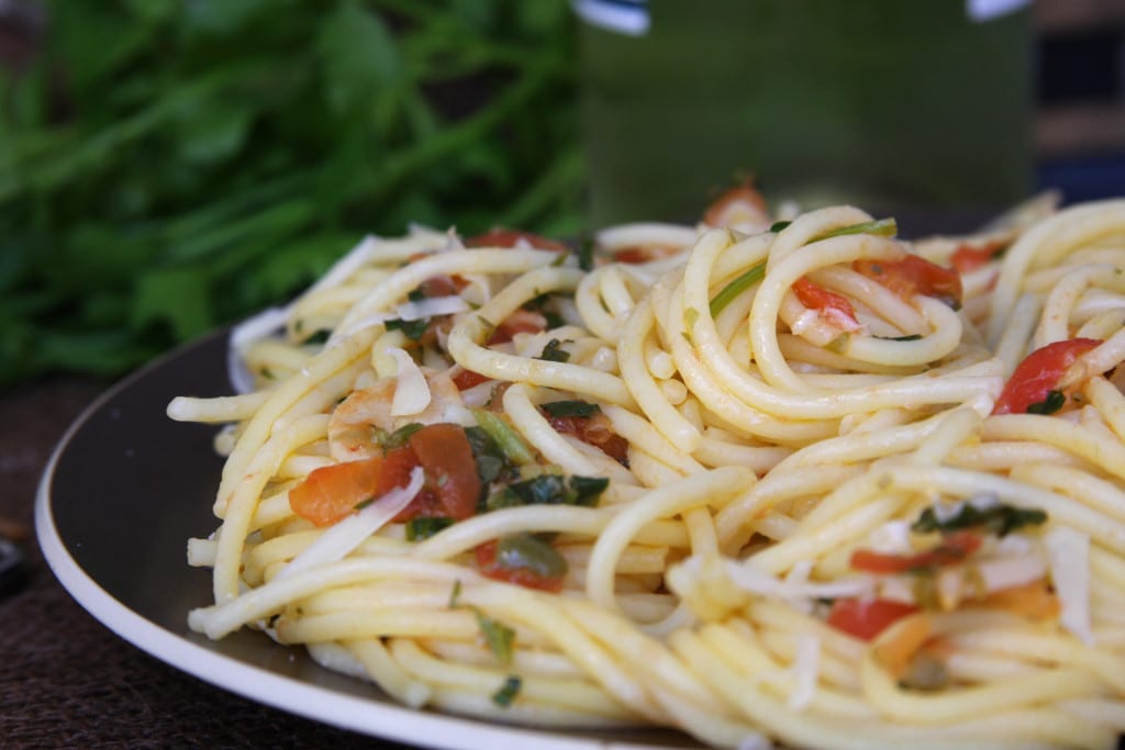 Tomato Caper Pasta recipe is a light & savory meal with fresh Italian parsley, tomatoes, capers and slivered garlic.