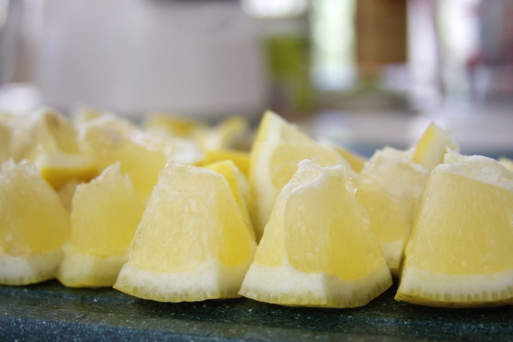 Cut lemons for Vodka Honey Lemonade