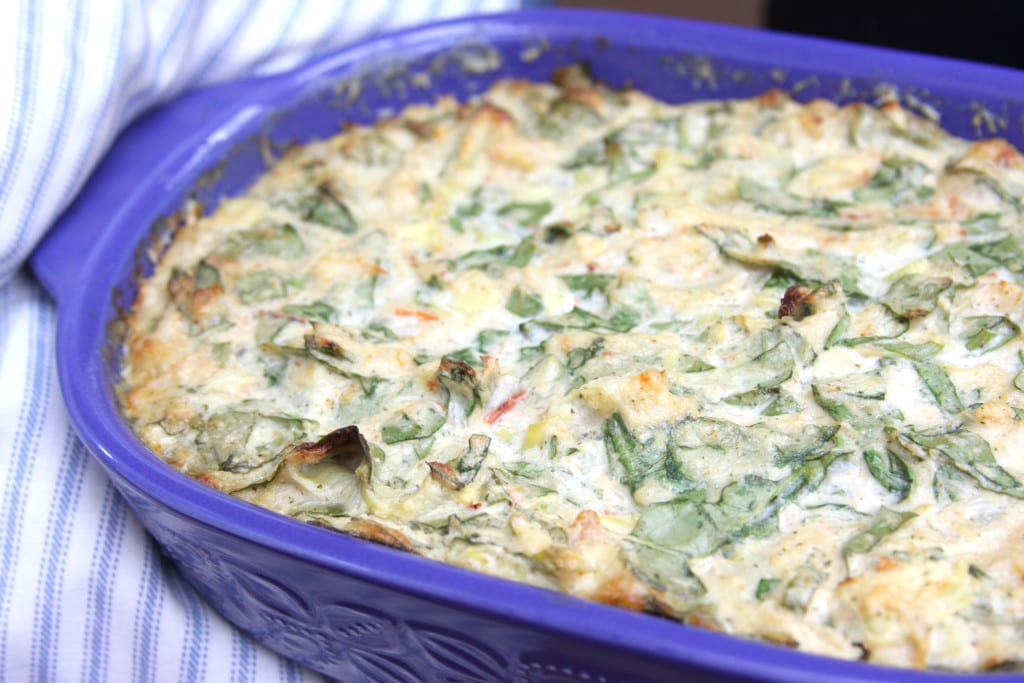 This dip recipe out of the oven in a blue casserole dish.