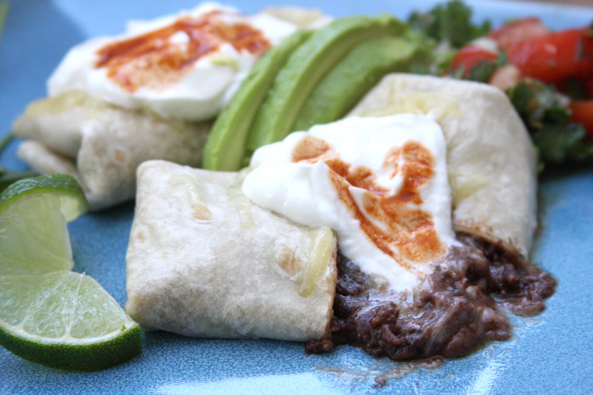 The Black Bean Burrito 1 recipe is organic & budget friendly. Zesty, rich beans with creamy and tangy cheese will make you feel like you are eating like a king.