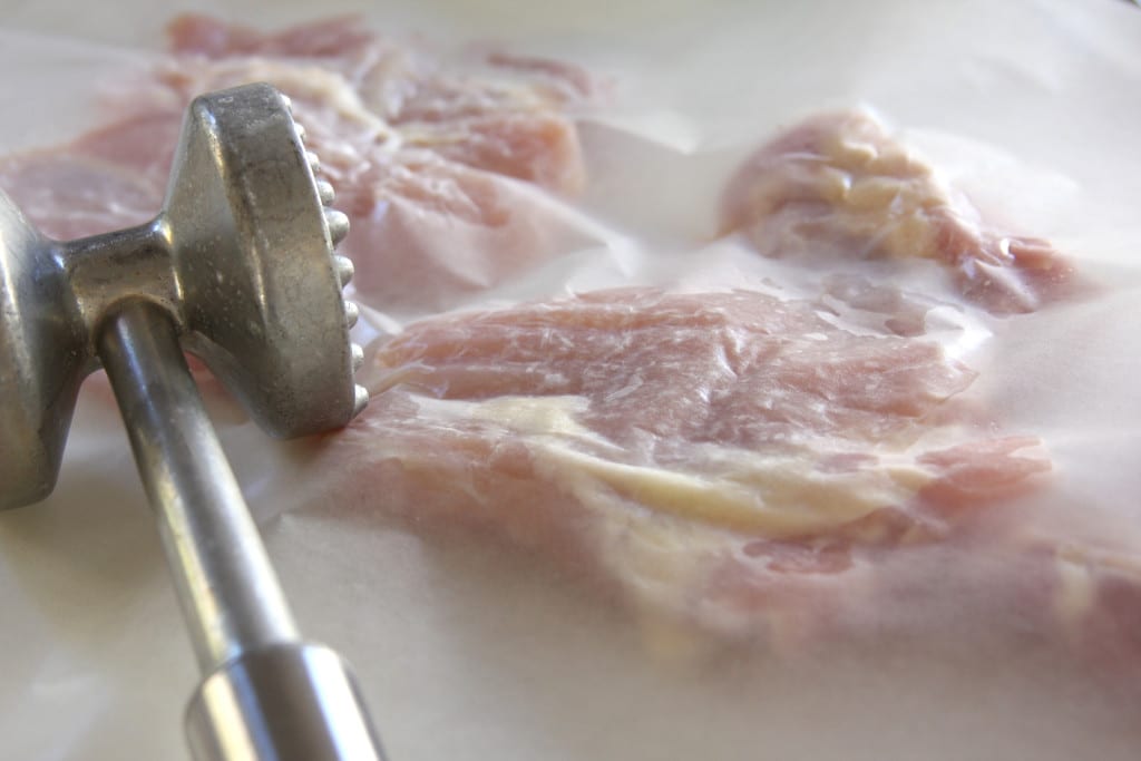 Pounding chicken thighs for Asian Chicken Sriracha Bowl