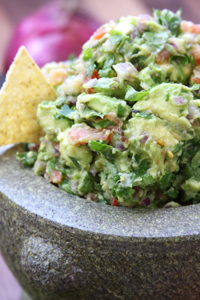 Simple Healthy Guacamole recipe is incredibly fresh and flavorful. Authentically made with chunky avocados and tomatoes. This will spoil you for all other guacamoles.