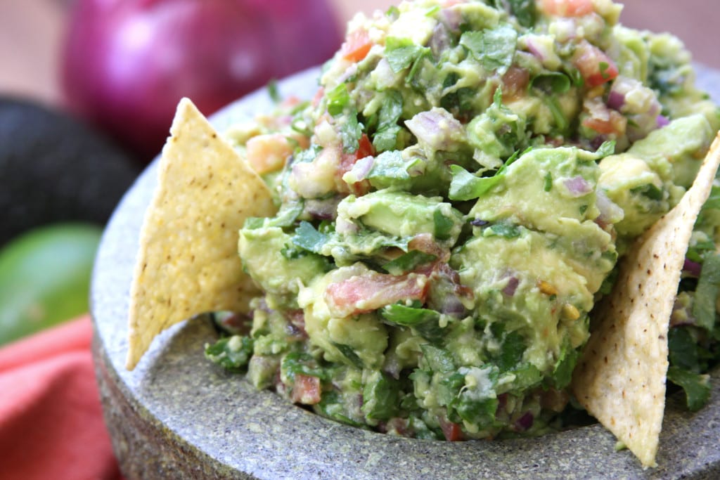 Simple Healthy Guacamole recipe is incredibly fresh and flavorful. Authentically made with chunky avocados and tomatoes. This will spoil you for all other guacamoles.