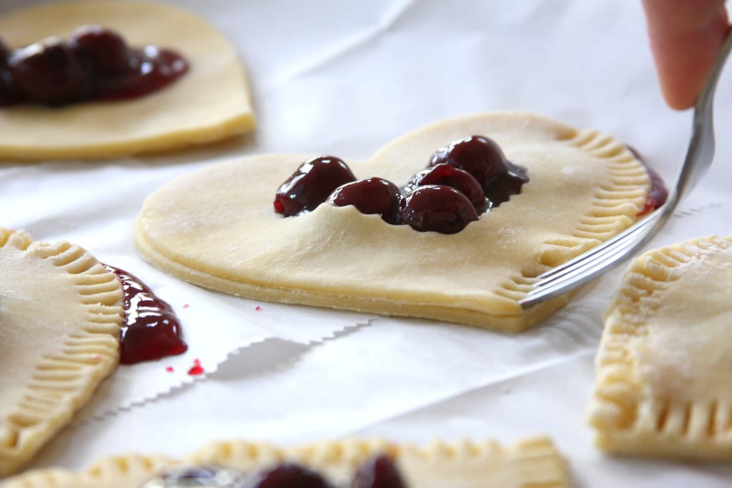 Sealing the edges of Cherry Heart Pies