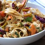 Chicken Peanut Udon Noodle Salad recipe is a cold pasta salad with flavors of sesame oil, peanut butter, sriracha and lime. Such a fun way to eat veggies in the colors of the rainbow. My husband was drooling over this dish.