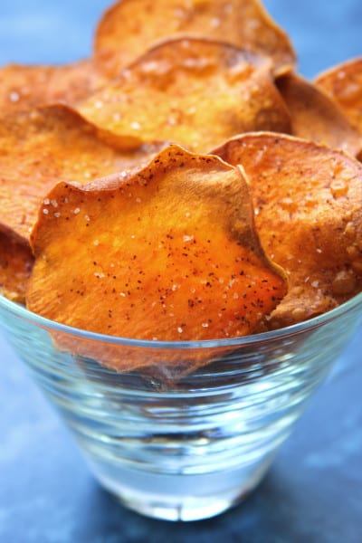 Homemade Sweet Potato Chips have a light crispiness and are kissed with chili powder.