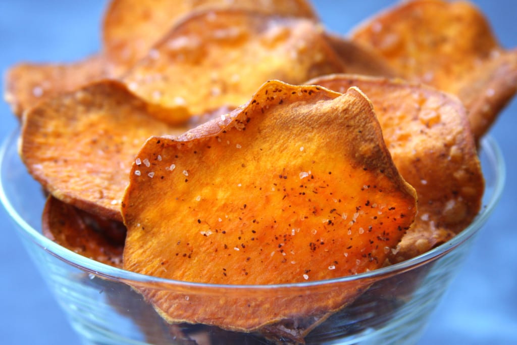 Homemade Sweet Potato Chips are cooked in coconut oil and kissed with chili powder. The perfect chip for healthy nachos.