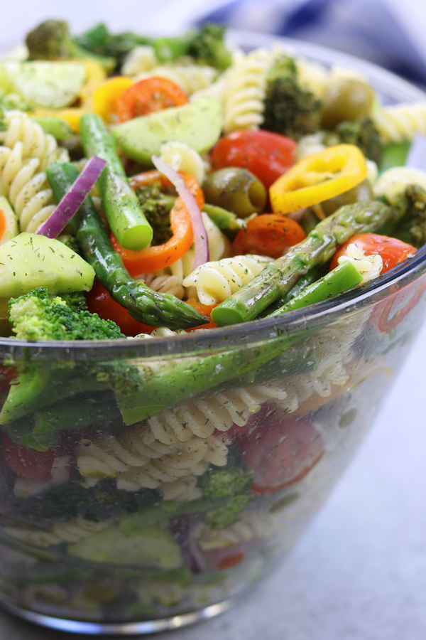 Springtime Pasta Salad recipe is light & savory. Perfect make ahead meal for company or potluck. Has simple lemon vinaigrette, olives and fresh veggies.