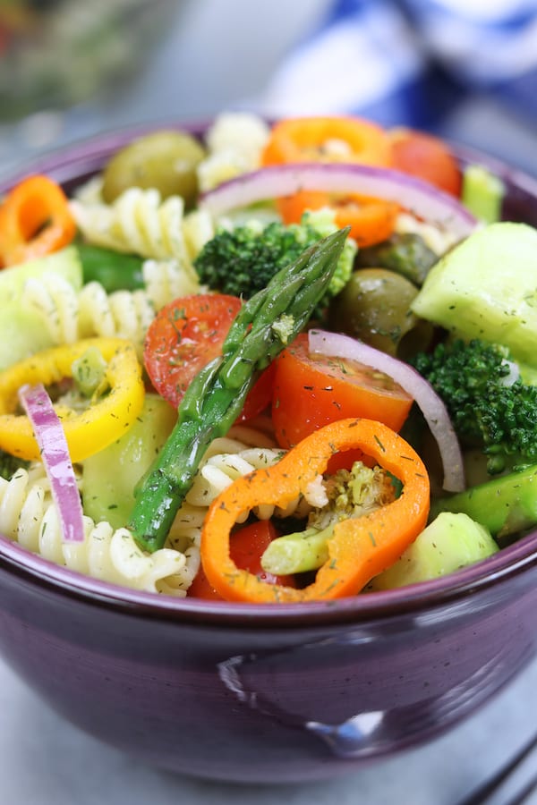 Springtime Pasta Salad recipe is light & savory. Perfect make ahead meal for company or potluck. Has simple lemon vinaigrette, olives and fresh veggies.