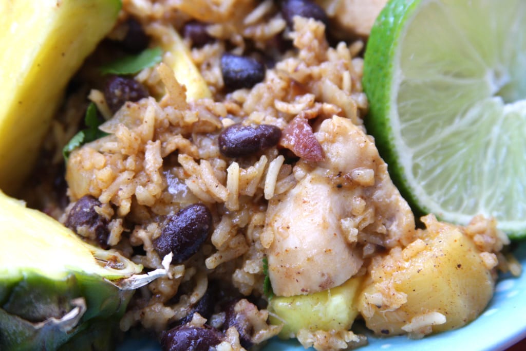 Caribbean Chicken & Rice recipe will transport you on a tropical vacation with sweet pineapple, savory bacon, satisfying black beans and Caribbean spices.