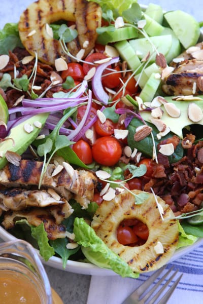 Grilled Pineapple Sesame Chicken Salad recipe is an absolute crowd pleaser. Perfect salad for company or a holiday get together.