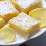 Lusciously Lemon Bars recipe is the perfect mouth watering treat for the lemon lovers in your life. Sweet, buttery and the companion with a cup of tea. These sunny little treats disappeared so fast.