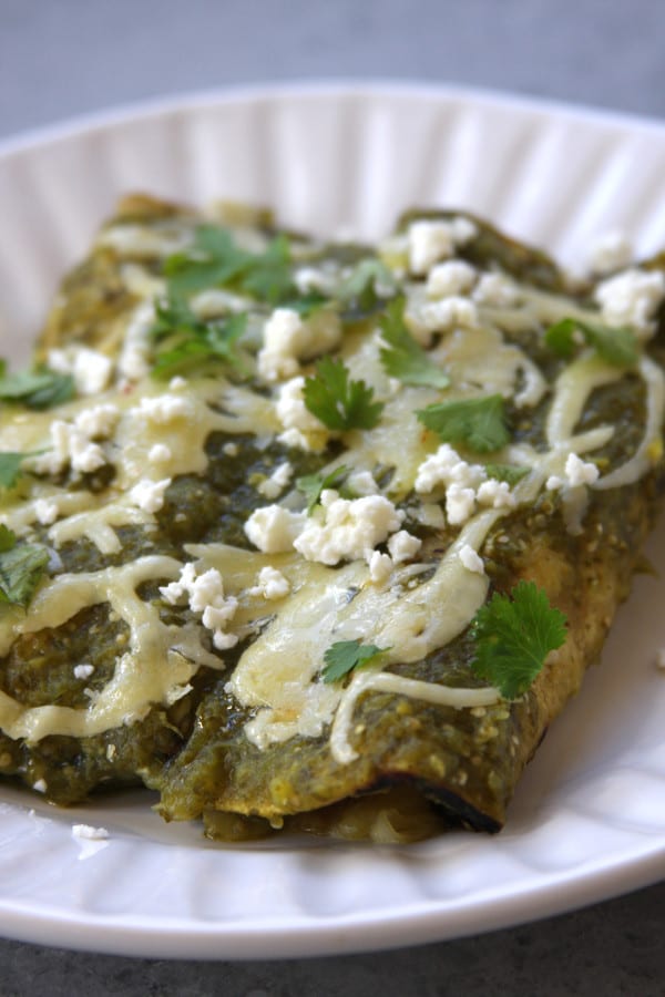 Lightened Up Salsa Verde Chicken Enchiladas recipe is lower in calories than your traditional enchilada but bursting with the same wonderful flavors. This is a family favorite that puts a smile on everyone's face.