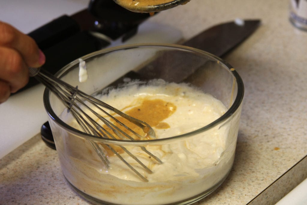 Tempering the yogurt for Grilled Chicken Tikka Masala.