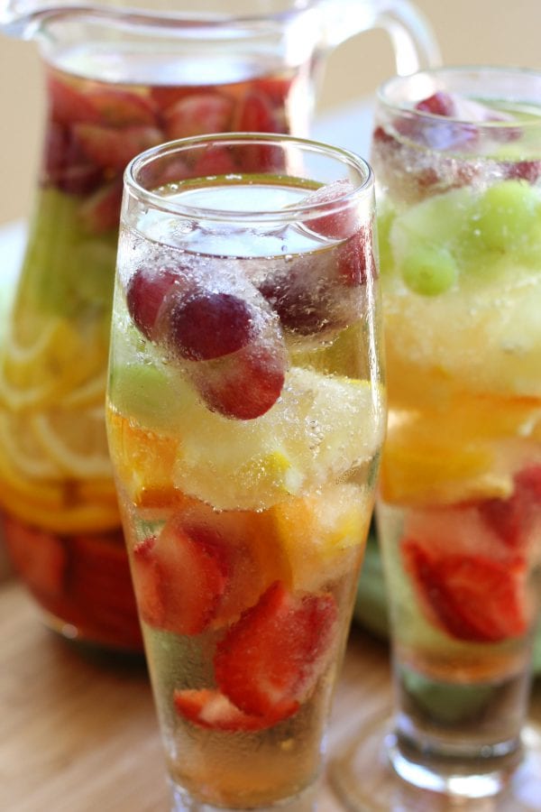 Rainbow Tequila Sangria recipe is a refreshing adult cocktail with strawberries, citrus and grapes all mingled with crisp sauvignon blanc and your favorite tequila. It is as much to look at as it is to drink.