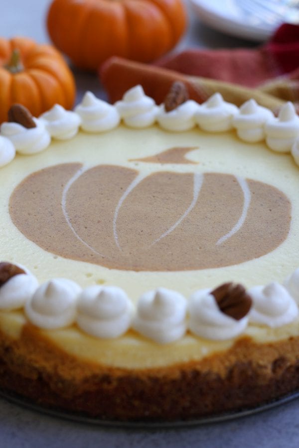 Creamy and decadent, this Pumpkin Cheesecake stands above the rest with a gingersnap, graham and pecan crust. Layered pumpkin and vanilla cheesecake makes this a beautiful and delicious dessert for your Holidays.