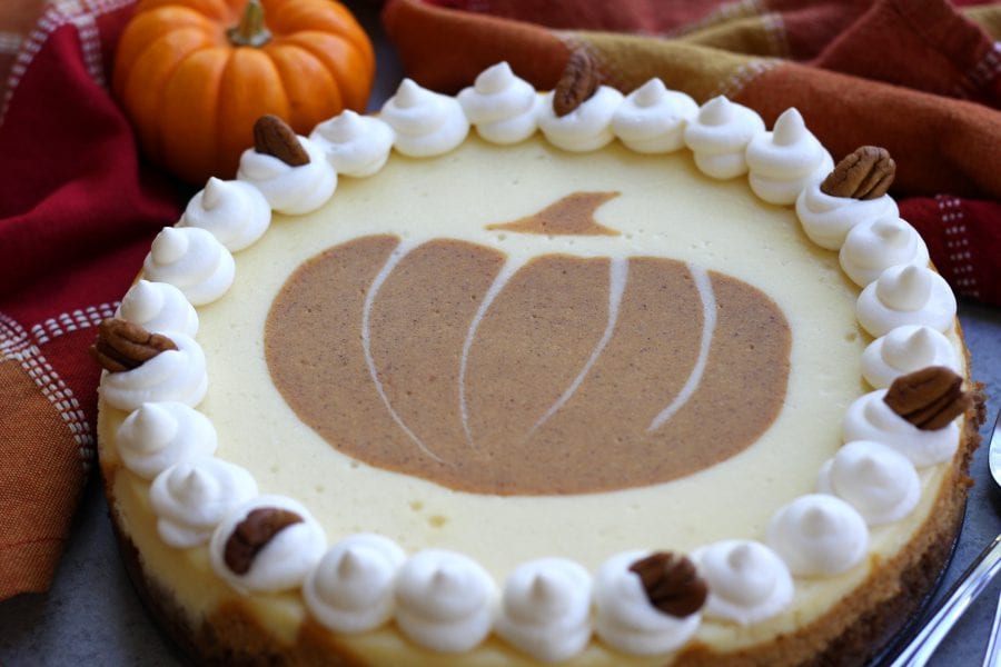 Creamy and decadent, this Layered Pumpkin Cheesecake stands above the rest with a gingersnap, graham and pecan crust. Layered pumpkin and vanilla cheesecake makes this a beautiful and delicious dessert for your Holidays.