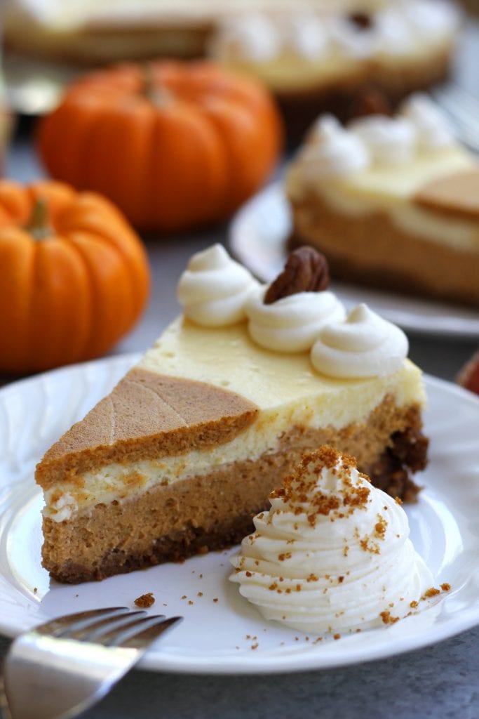 Creamy and decadent, this Layered Pumpkin Cheesecake stands above the rest with a gingersnap, graham and pecan crust. Layered pumpkin and vanilla cheesecake makes this a beautiful and delicious dessert for your Holidays.