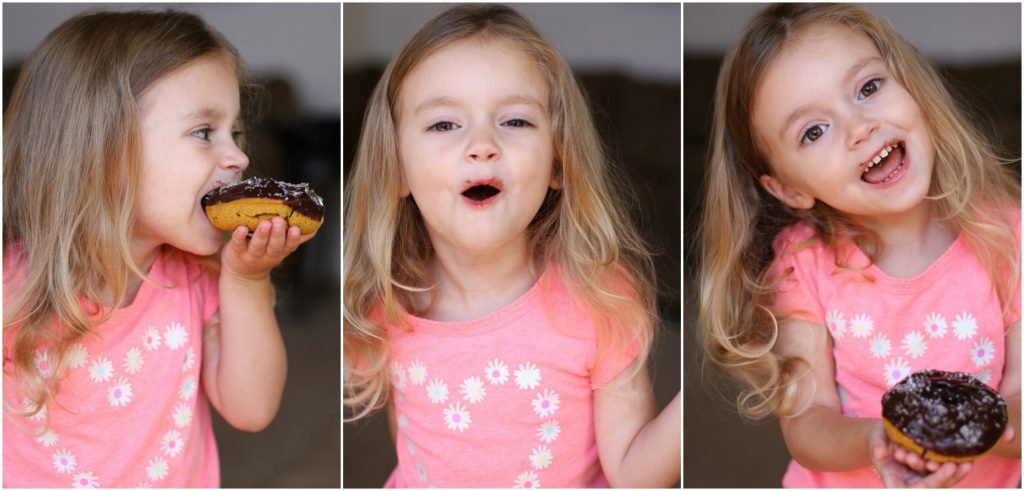 Happy chocolate smiles eating Spiced Pumpkin Donuts.