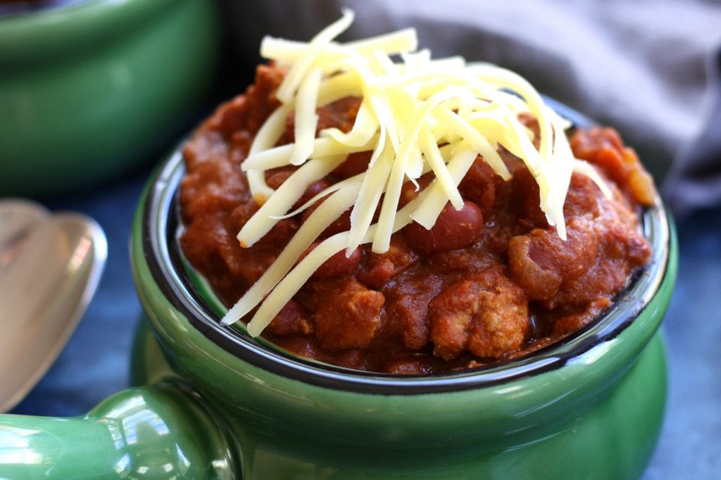 Hearty Homemade Chili recipe is savory enough for the adults and mild enough for the kiddos. Satisfying and comforting, it is a family favorite and we always have to keep extra in the freezer.