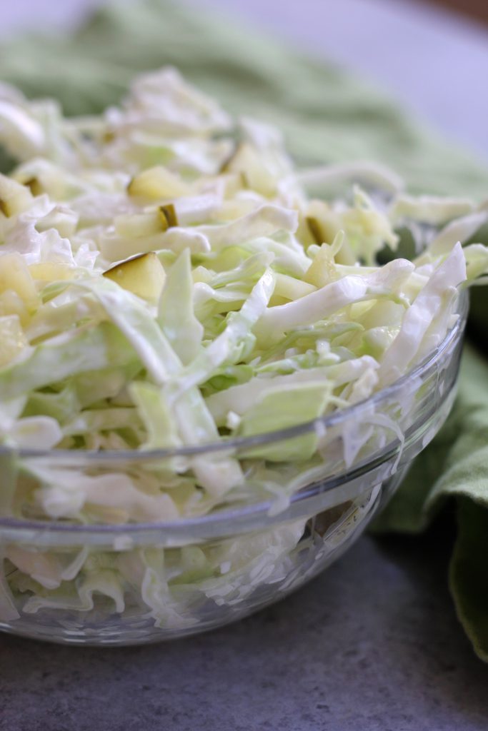 Simple Coleslaw is an easy and delicious side dish that comes together in minutes. Low-carb and gluten free, it's the perfect companion to many a dish.