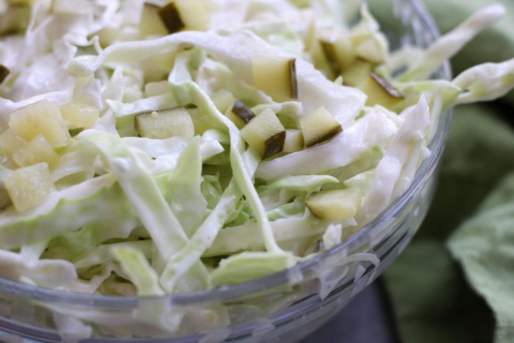 Simple Coleslaw is an easy and delicious side dish that comes together in minutes. Low-carb and gluten free, it's the perfect companion to many a dish.