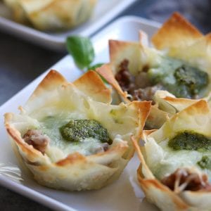 Crispy, cheesy and bursting with flavors of Italian Sausage and pesto, these Italian Cheesy Bites are a wonderful appetizer for your Holiday get togethers.