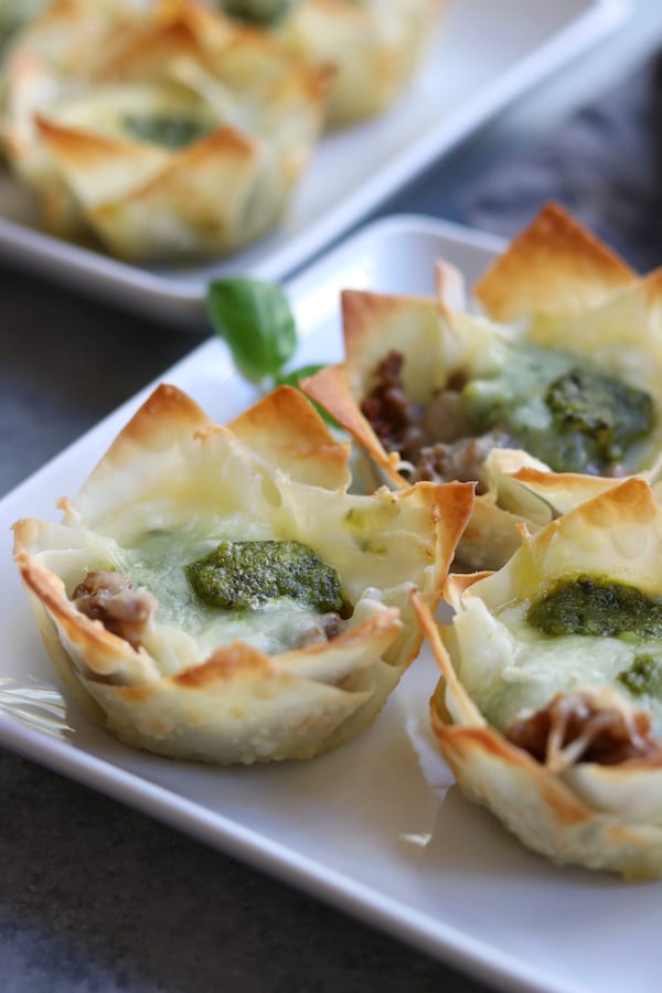 Crispy, cheesy and bursting with flavors of Italian Sausage and pesto, these Italian Cheesy Bites are a wonderful appetizer for your Holiday get togethers.