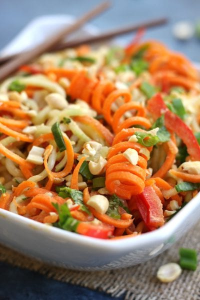 Incredibly healthy and delicious, Carrot Cucumber Asian Slaw will satisfy your taste buds and hunger alike. Perfect as a light lunch or dinner with it's fresh, crunchy veggies and the creamy nuttiness of a sesame, peanut dressing.