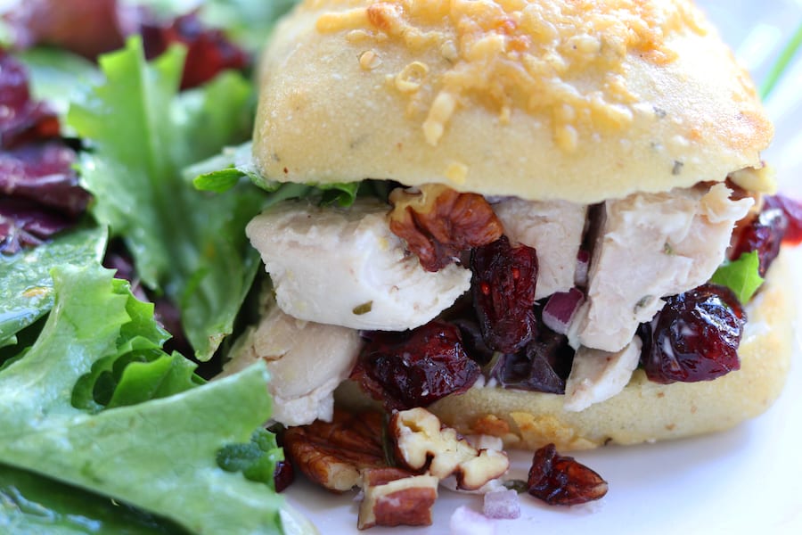 Pecan Cranberry Chicken Salad makes a perfect light and tasty lunch nestled in your favorite bread. Sweet, creamy and savory, you will feel like you just had lunch at a sidewalk cafe. 