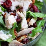 Pecan Cranberry Chicken Salad makes a perfect light and tasty lunch nestled in your favorite bread. Sweet, creamy and savory, you will feel like you just had lunch at a sidewalk cafe.