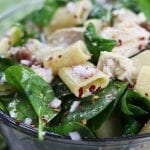 Zesty Chicken Pasta Salad has a subtle balance of tang to spice with red chili pepper flakes, feta, onion and garlic. Simple, fresh and easy to make, this pasta salad is perfect anytime of year.