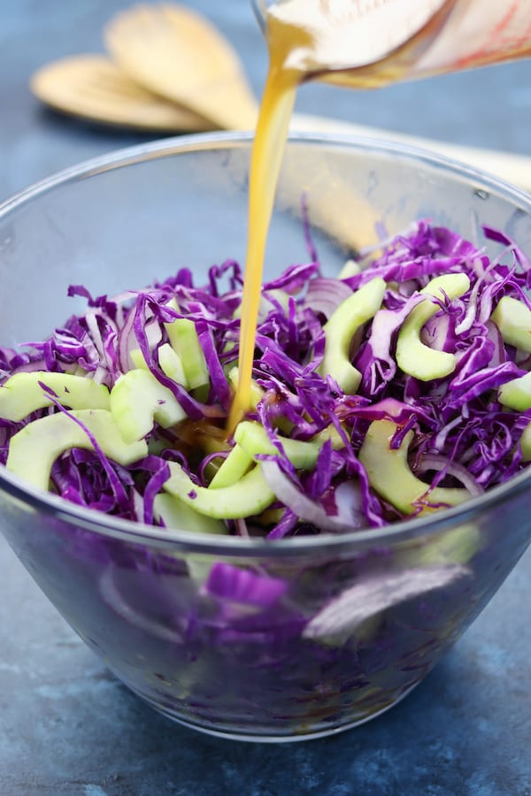 This Simple Asian Slaw recipe is a crispy and refreshing companion to many asian dishes. Comes together in minutes, disappears almost as fast and is a fun way to eat your veggies. 