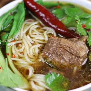 Beef Asian Noodle Soup is love at first bite or should I say Slurp? Tender beef and crispy baby bok choy is served over a rich Asian spiced broth with gratifying lacy noodles.