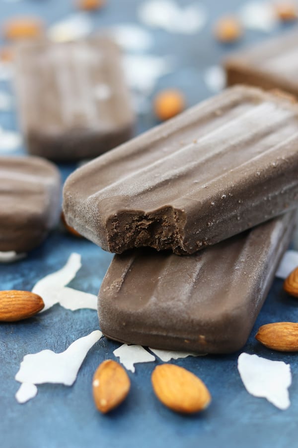 Creamy and sweetened with a kiss of honey, these Almond Joy Fudgesicles are a wonderful no-guilt popsicle that the whole family will love.