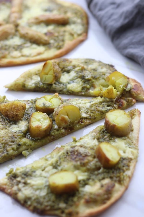 Potato Gorgonzola Pesto Naan Pizza is such a fun twist from the traditional Friday night pizza. Nutty pesto plays so well with the buttery potatoes and Italian gorgonzola. This recipe has become a major hit in our house.