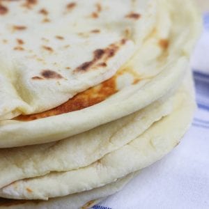 Learn the basics of making Homemade Naan, an easy & fluffy skillet bread that goes perfectly with Indian dishes or can be used to make pizza.