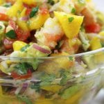 Refreshing and satisfying, Mango Shrimp Salsa is a fruity seafood feast that is perfect for parties or as a meal on hot summer nights.