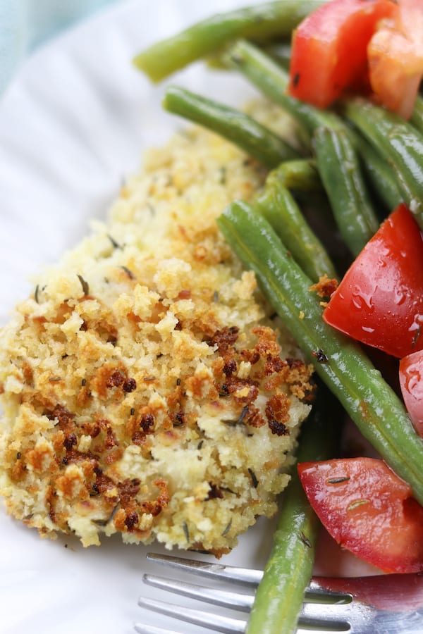 A sheet pan dinner with herby panko chicken and baked green beans that are easily dressed into a salad. Light and healthy, this is a perfect week night dinner.