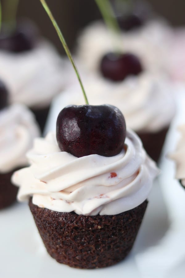 A fudgy bite of brownie topped with cool creamy cherry whipped cream makes this Black Forest Bites recipe a favorite among cherry and chocolate lovers. Incredibly easy to make with just a few ingredients to mix together. These were the hit of the dinner party! 