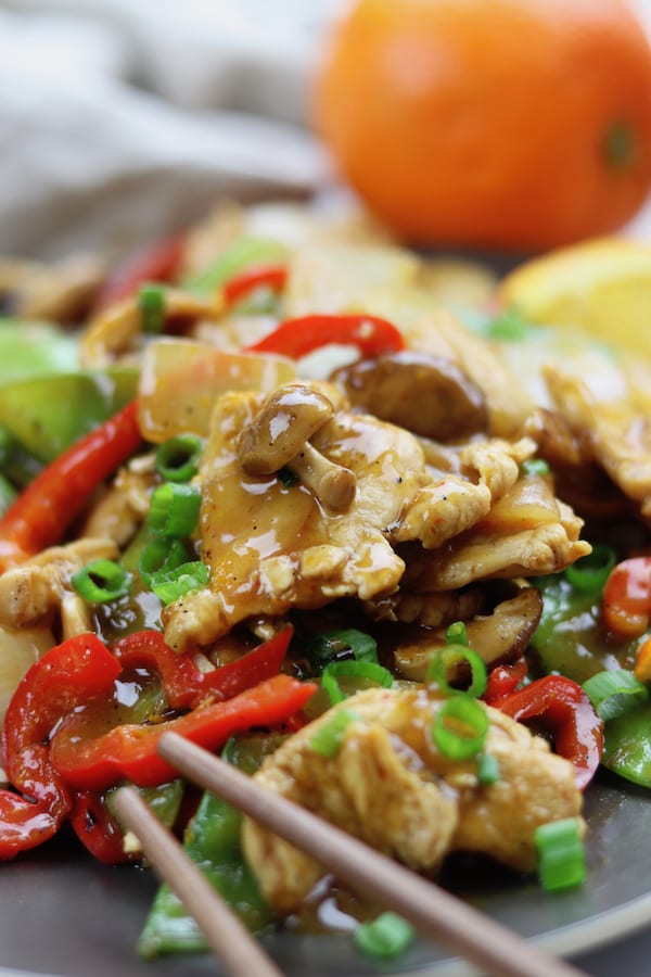 Citrus Chicken Stir Fry recipe is clean eating at its best. Stir fried veggies and chicken are covered in a savory soy orange sauce. A family favorite recipe that comes together in less than 30 minutes.