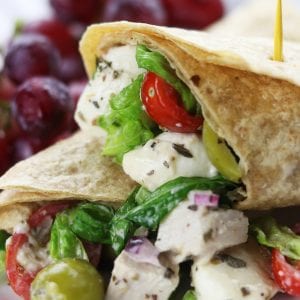 Creamy Italian Chicken Salad Wrap recipe is an easy and delicious meal. A whole wheat tortilla holds baked chicken, mozzarella cheese, veggies and a homemade creamy Italian dressing. Always a favorite as a make ahead lunch!