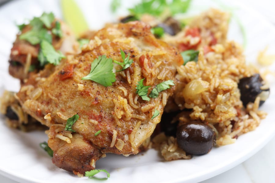 One Pot Spanish Chicken and Rice recipe is a simple, comforting meal bursting with flavor. An easy 15 minutes to prep and then pop in the oven to bake, this has become one of my favorite go to recipes that even children love.