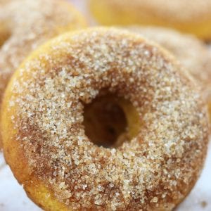 Orange Spiced Pumpkin Cake Donuts is an easy, family favorite recipe that will delight your taste buds. Hints of refreshing orange are nestled in fluffy pumpkin cake and top with cinnamon sugar. Made with healthy ingredients, this is one of the best baked donuts ever!