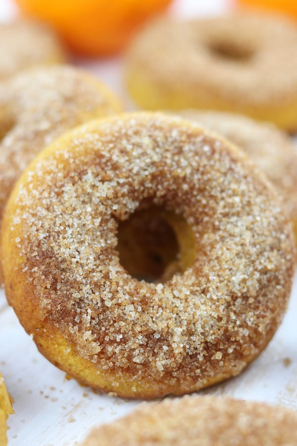 Orange Spiced Pumpkin Cake Donuts is an easy, family favorite recipe that will delight your taste buds. Hints of refreshing orange are nestled in fluffy pumpkin cake and top with cinnamon sugar. Made with healthy ingredients, this is one of the best baked donuts ever!