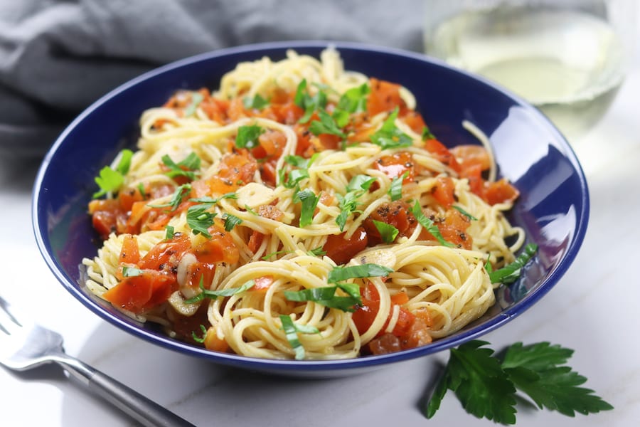 Simple Angel Hair Pasta recipe has only 5 ingredients but feels like an Italian feast. Add your favorite protein or leave as is for a favorite vegetarian meal. Perfect for a quick and easy dinner.