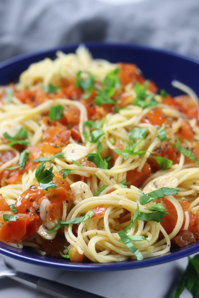 Simple Angel Hair Pasta recipe has only 5 ingredients but feels like an Italian feast. Add your favorite protein or leave as is for a favorite vegetarian meal. Perfect for a quick and easy dinner. 