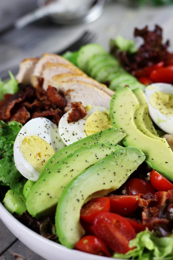 Undressed Chicken Avocado and Bacon Salad Recipe with pepper.