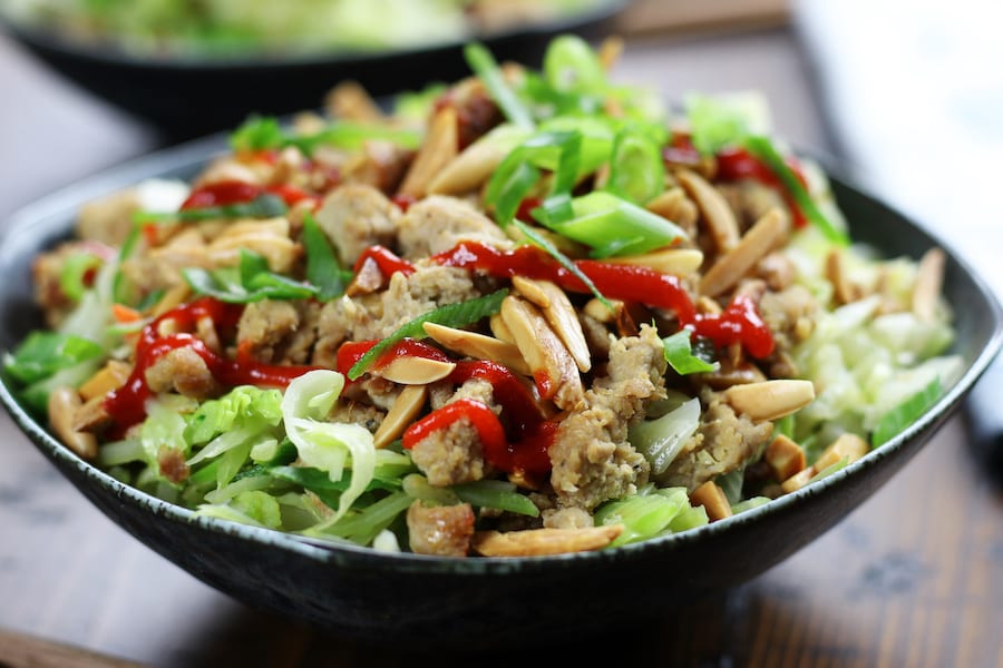 Chicken and Cabbage Stir Fry with sesame toasted almonds and sriracha.