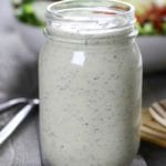 Creamy Low Carb Ranch Dressing sitting in front of a salad.